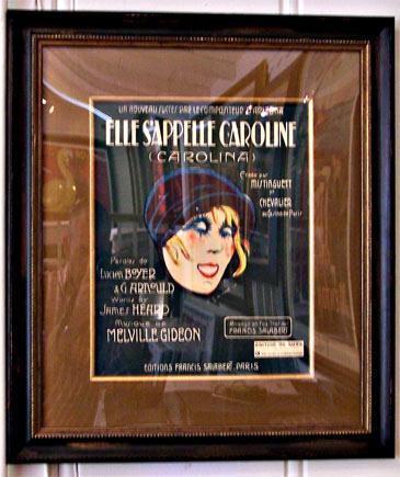 Original poster: Elle S'appelle Caroline "Carolina" created for Mistinguett et M. Chevalier at the Casino de Paris. (note glare is in the glass.... The artwork is perfect condition.) Framed with handwrapped silk matt, plexi, gold filet, and distresse
