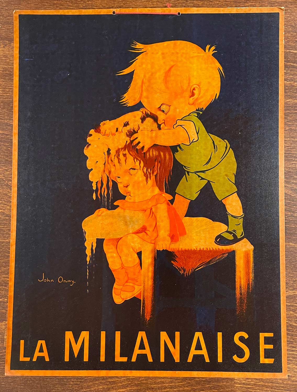 An angry young man viisciously scrubs his little sisters hair with La Milanaise shampoo.