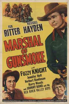 Marshal of Gunsmoke, apparently Gunsmoke is a town and Tex Ritter runs it.