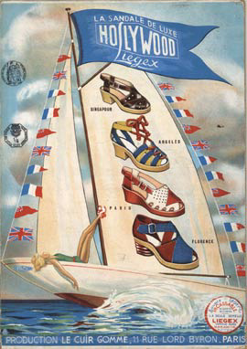 A pretty lady on a sailboat wearing the shoes she's advertising.(Whore) The sandals are Hollywood Sandals